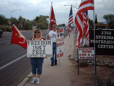 Marine Mom with flag and sign Freedom isn't Free - Support the Troops